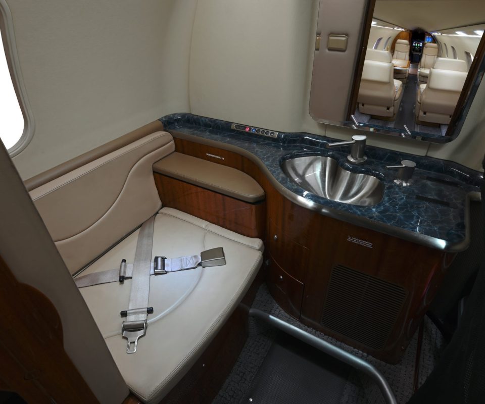 Aft lavatory with belted seat